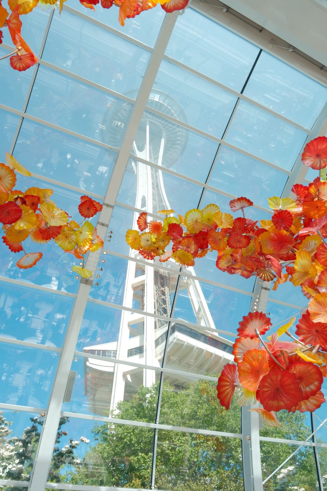Chihuly's orange glass flowers glowing beneath the Space Needle