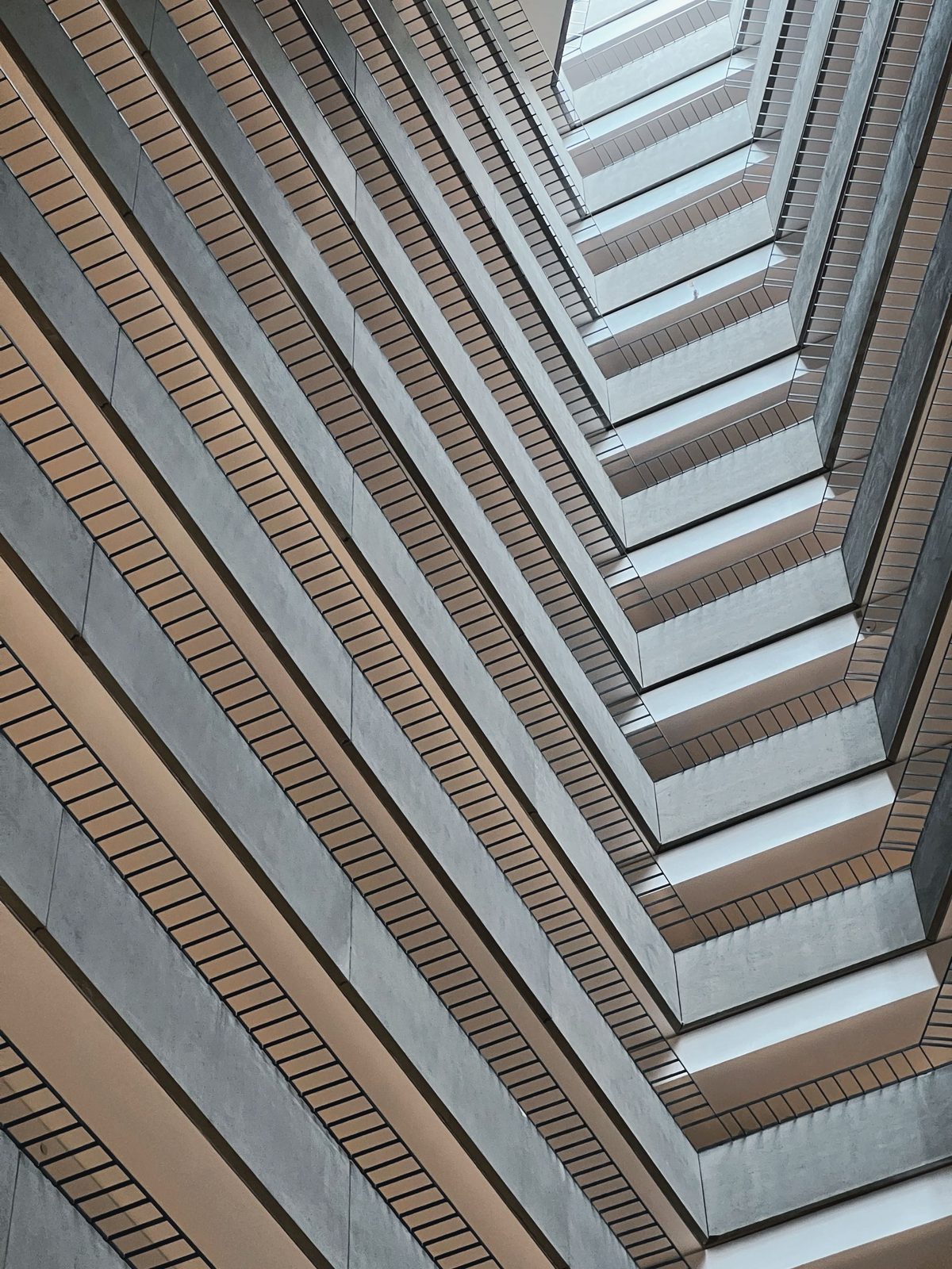 Looking up at the layered balconies of an atrium