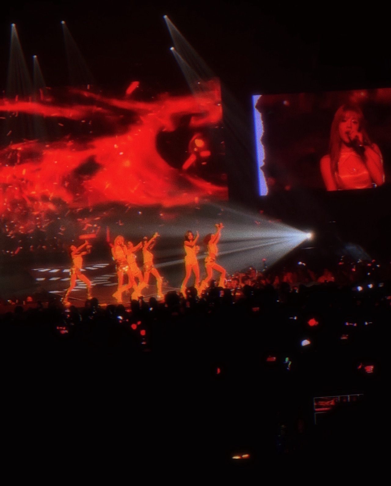 BABYMONSTER performing at HELLO MONSTERS, Sep 2025, the group lit in red beneath sweeping spotlights