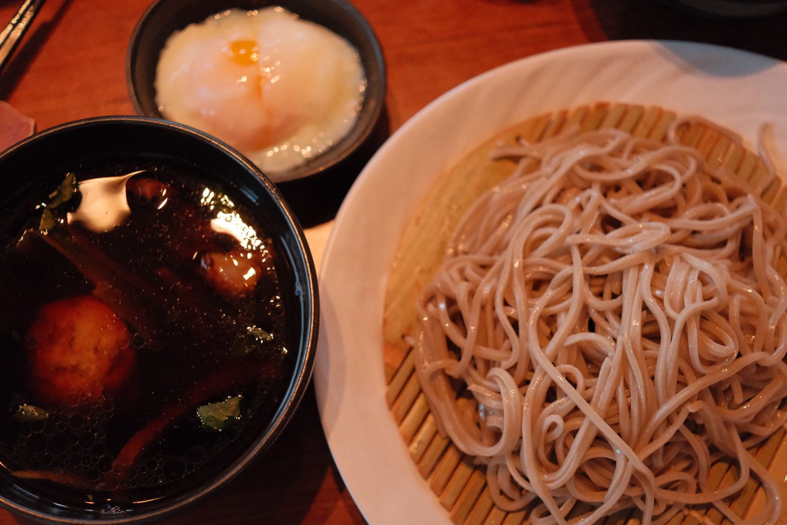 Cold zaru soba with dipping broth and a soft onsen egg